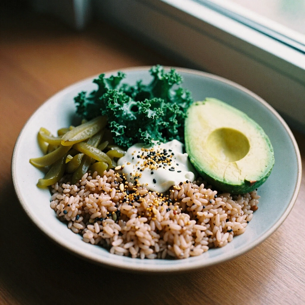 Kale pesto brown rice bowl with avocado, pickled vegetables and toasted seeds